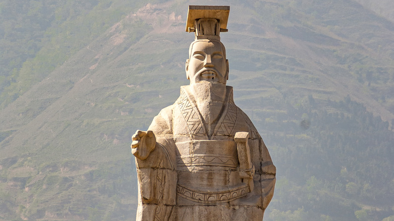 Statue of Qin Shi Huang in front of hill