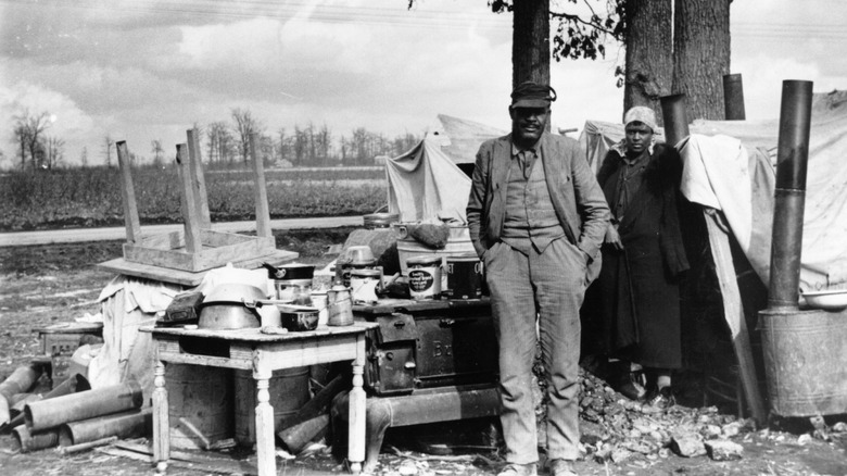 Evicted sharecroppers with their belongings on the road