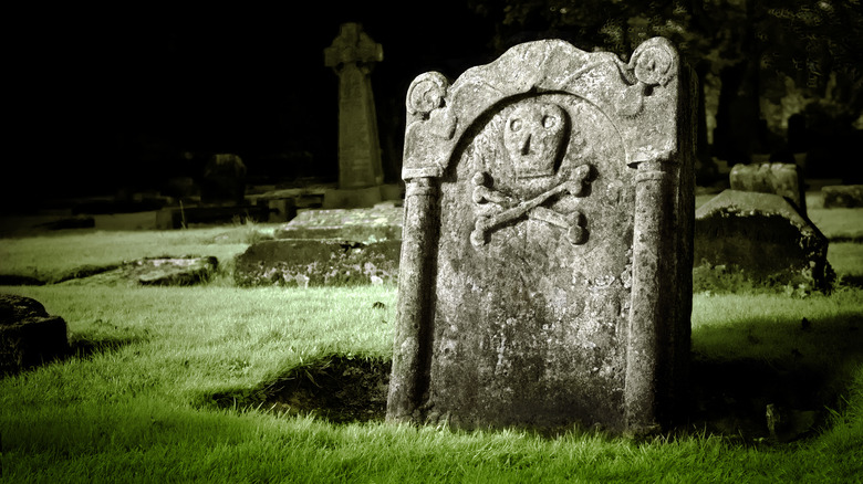 tombstone with a skull