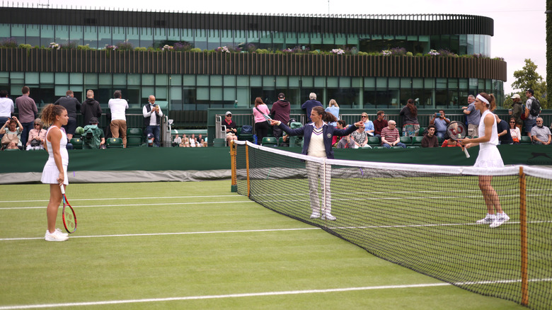 Umpire warning players at Wimbledon