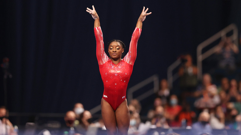 simone biles lands after performing on the vault