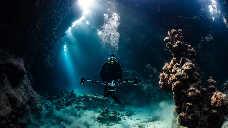A scuba diver in a cave