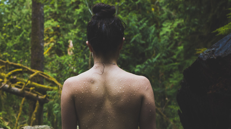 nude woman in forest