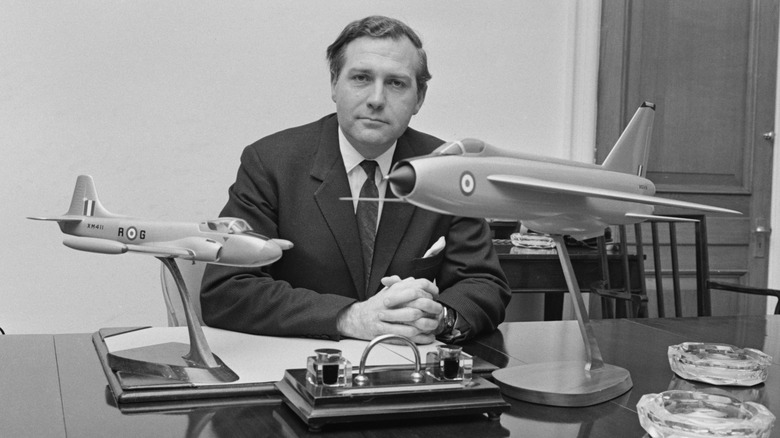 John Stonehouse holding plane models