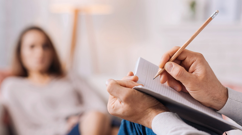 Psychiatrist consulting with patient