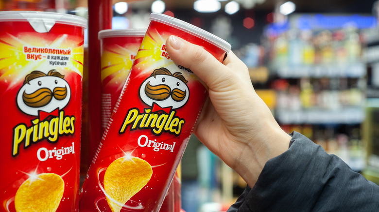 person getting Pringles