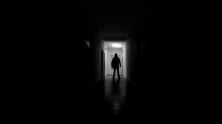 Man at end of hallway