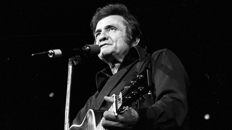 Johnny Cash playing guitar