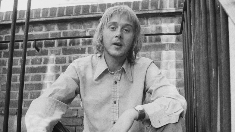 Danny Kirwan seated outside on steps