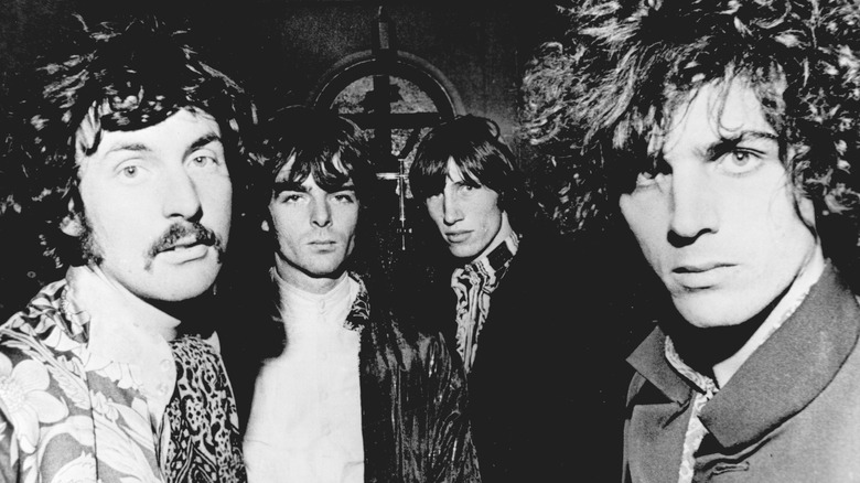 Pink Floyd looking at camera and posing