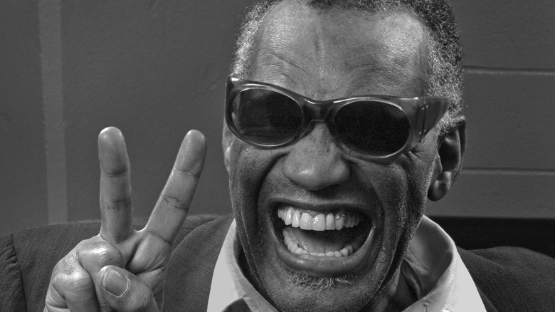 Ray Charles throwing a peace sign in 1982