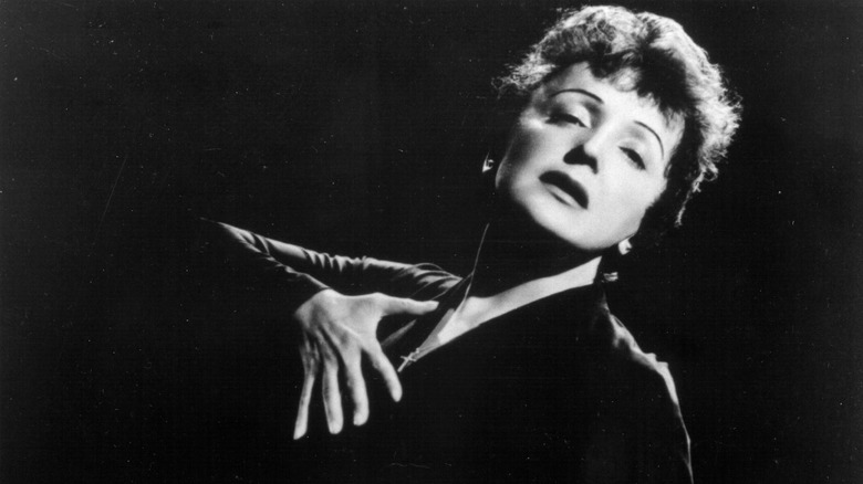 Edith Piaf with hand on chest