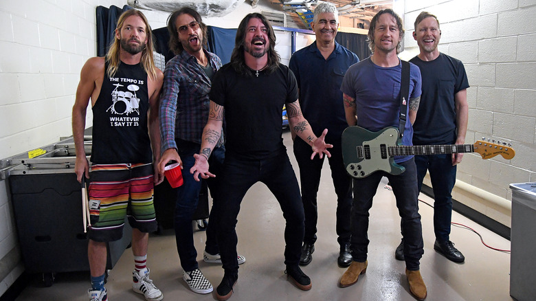 Foo Fighters posing backstage