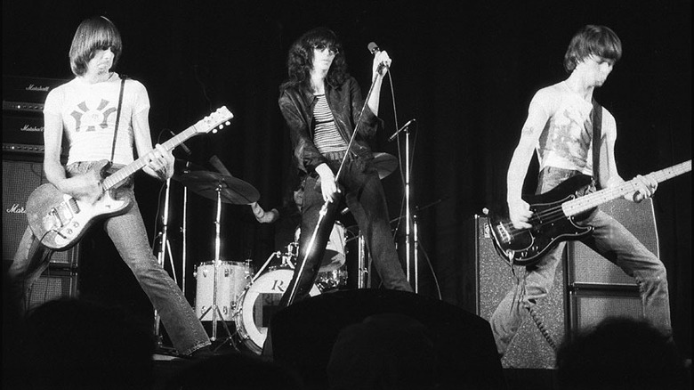 Cropped photo by Plismo of the Ramones onstage in Toronto in 1976, CC BY-SA 3.0
