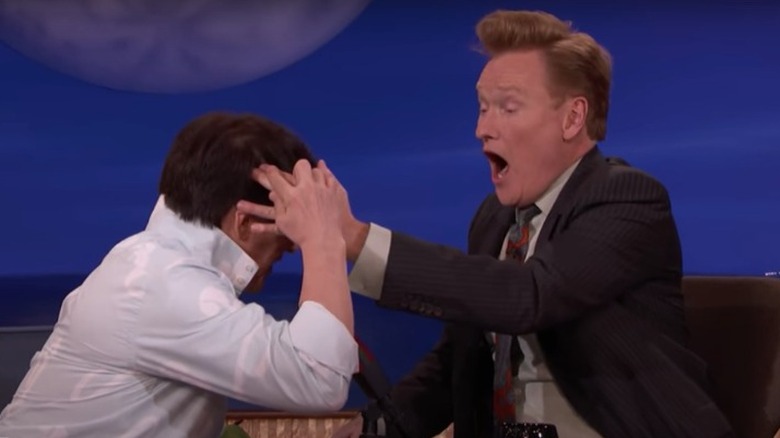 Jackie Chan showing Conan O'Brien the hole in his head