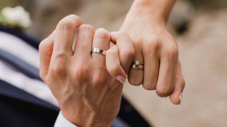 hands with wedding rings