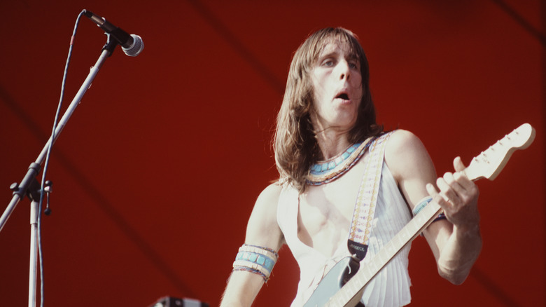 Todd Rundgren playing guitar onstage in 1976
