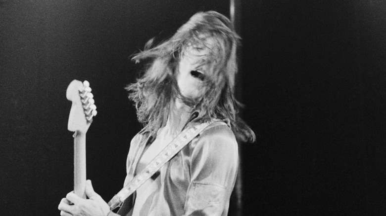 Todd Rundgren playing guitar in 1975
