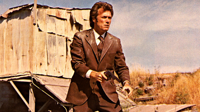 Clint Eastwood holding a gun as Dirty Harry