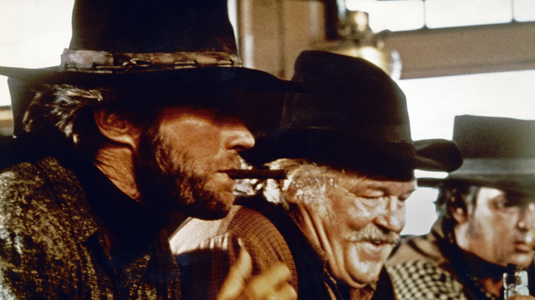 Eastwood acting alongside two other men in High Plains Drifter