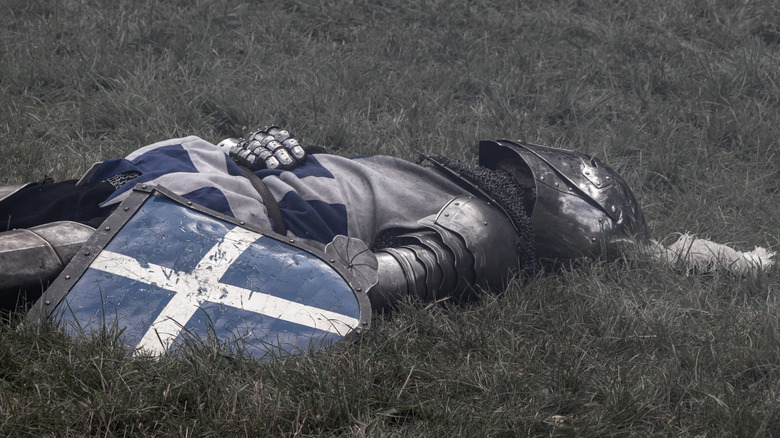 Fallen knight on battlefield