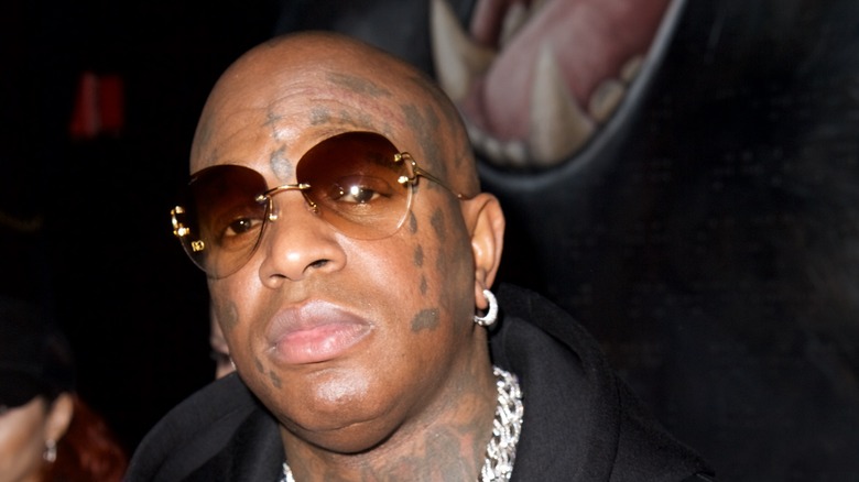 Birdman posing for a picture