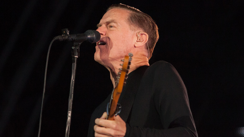 Bryan Adams singing on stage