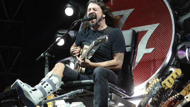 Dave Grohl plays with broken leg
