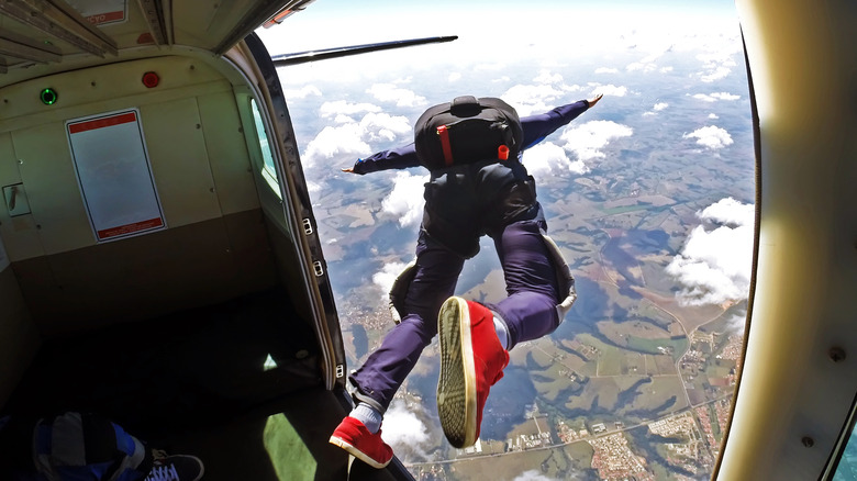 Skydiver jumping from plane