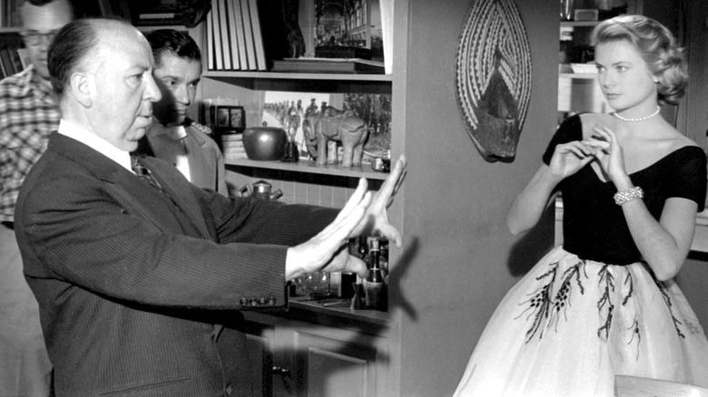 Alfred Hitchcock directing Grace Kelly