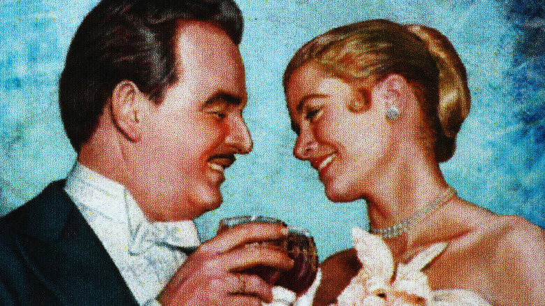 Postage stamp with Prince Rainier III and Grace Kelly, toasting one another