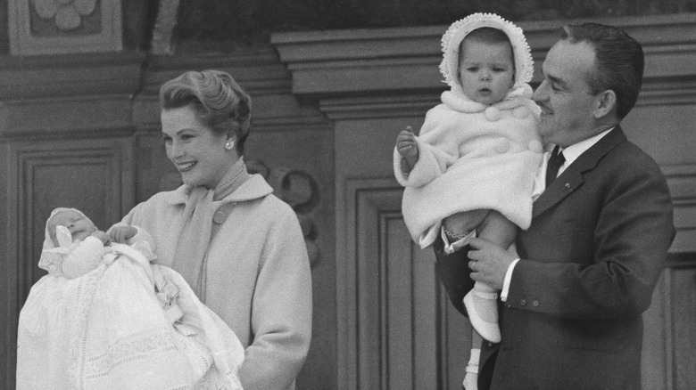 Grace Kelly holding son Albert, Prince Rainier III holding daughter Caroline