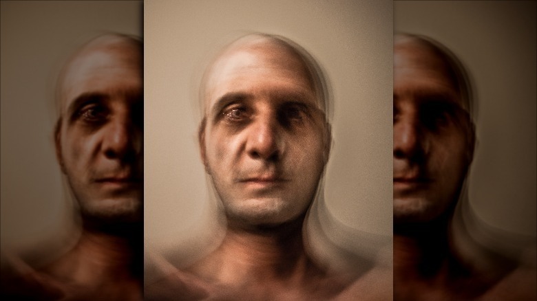 Blurry portrait of a bald man