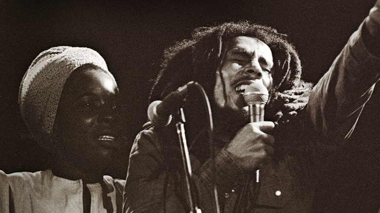 Rita Marley and Bob Marley performing