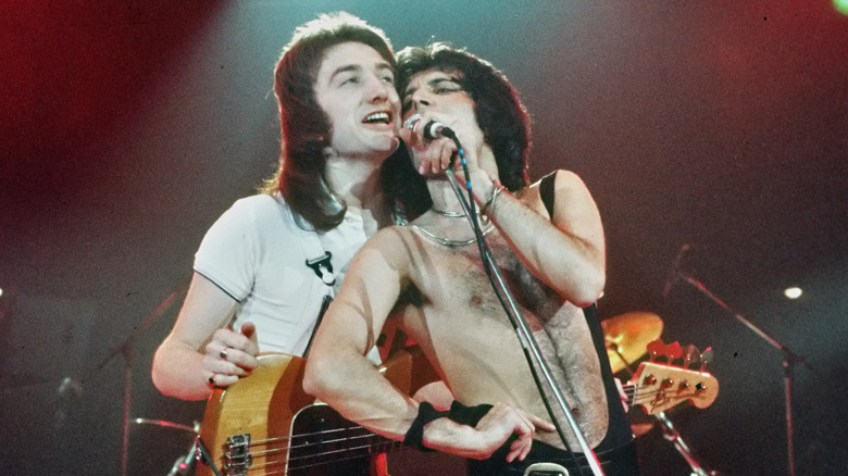 John Deacon singing with Freddie Mercury