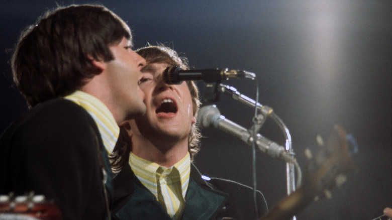 Paul McCartney and John Lennon performing in 1966