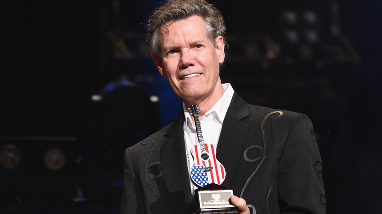 Randy Travis with award at the 2018 Country Music Awards