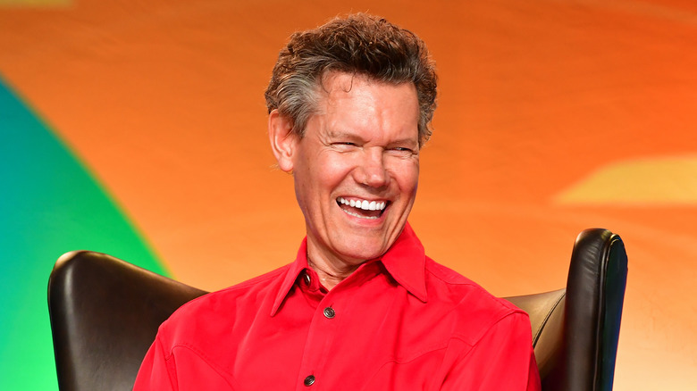 Randy Travis laughing on stage
