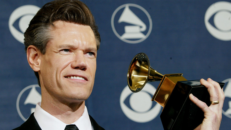 Randy Travis with a Grammy award