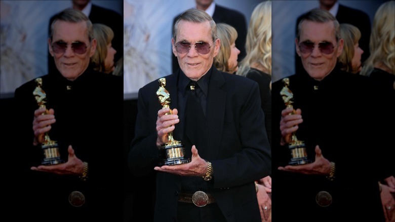 Hal Needham holding an Oscar