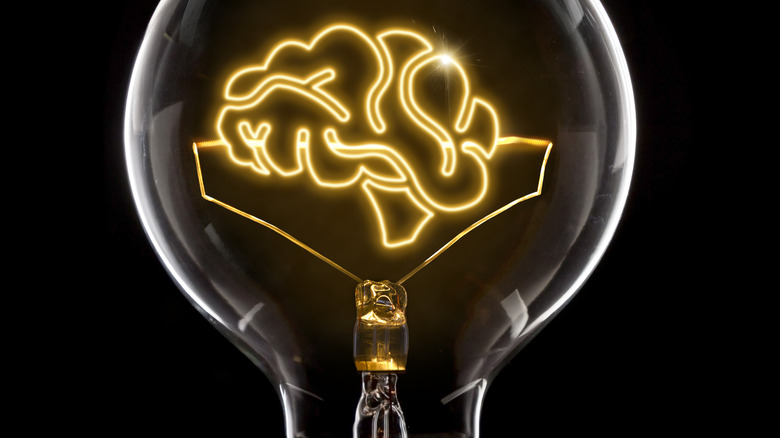 lightbulb with brain inventing