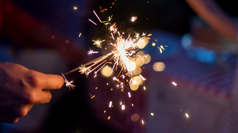 holding sparkler fireworks