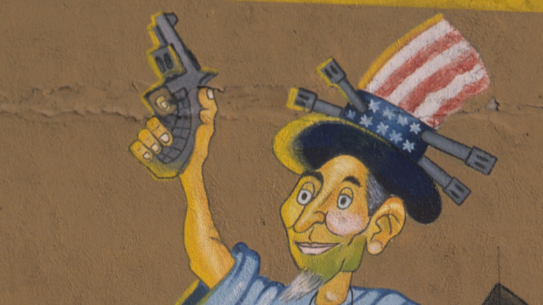 Uncle Sam caricature with a gun