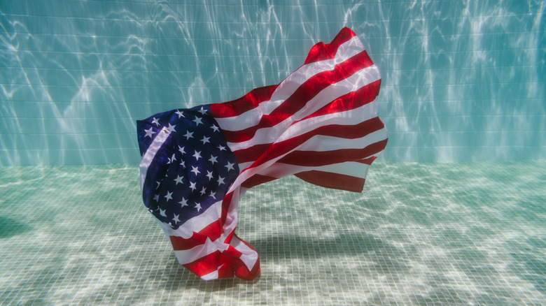 American flag underwater in pool