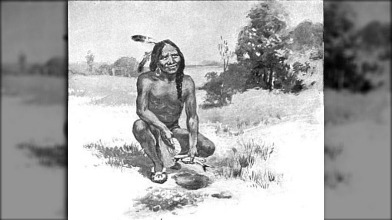 Squanto or Tisquantum teaching the Plymouth colonists to plant corn with fish, 1911 illustration