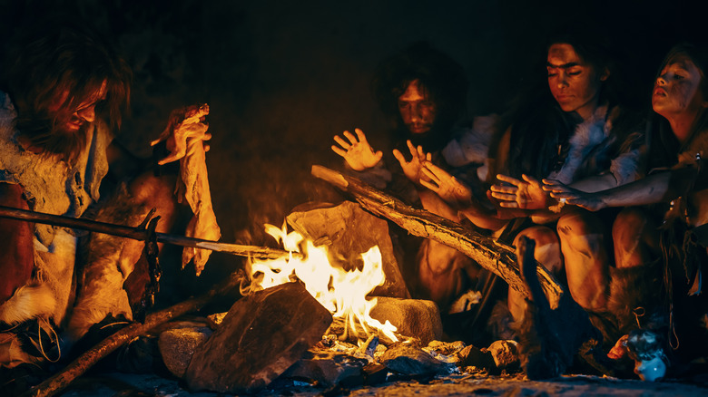 Prehistoric family by the fire