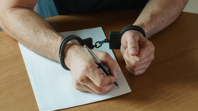 Defendant writing a confession