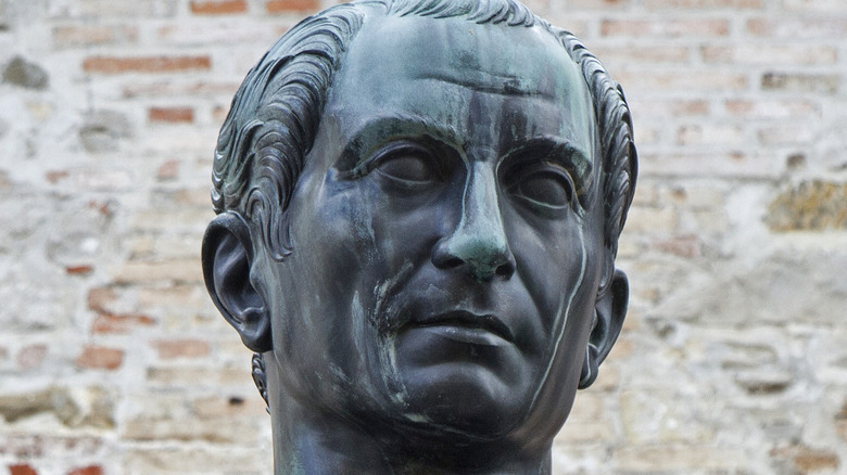 why did caesar burn the library of alexandria