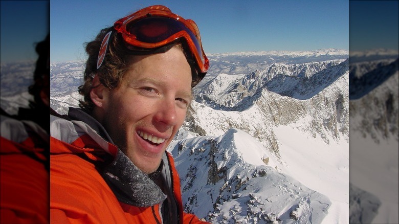 Aron Ralston posing on a mountain