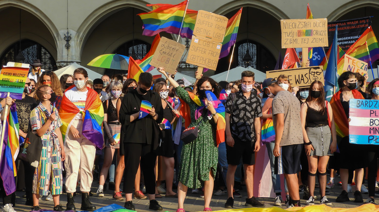 LGBT protestors holding signs